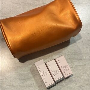 Chantecaille Orange Cosmetic Bag with Skincare
